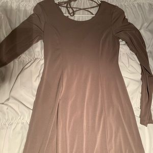 Tight taupe colored dress with cross back